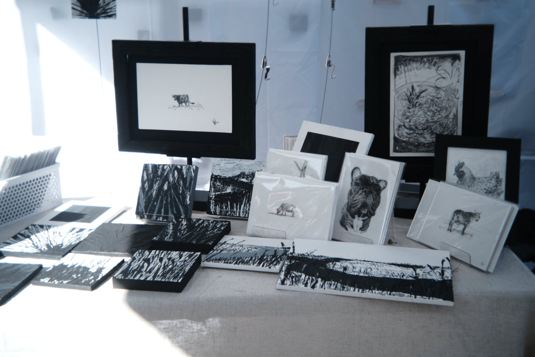 Finished graphite pieces displayed at the Isle of Hope Art and Music Festival