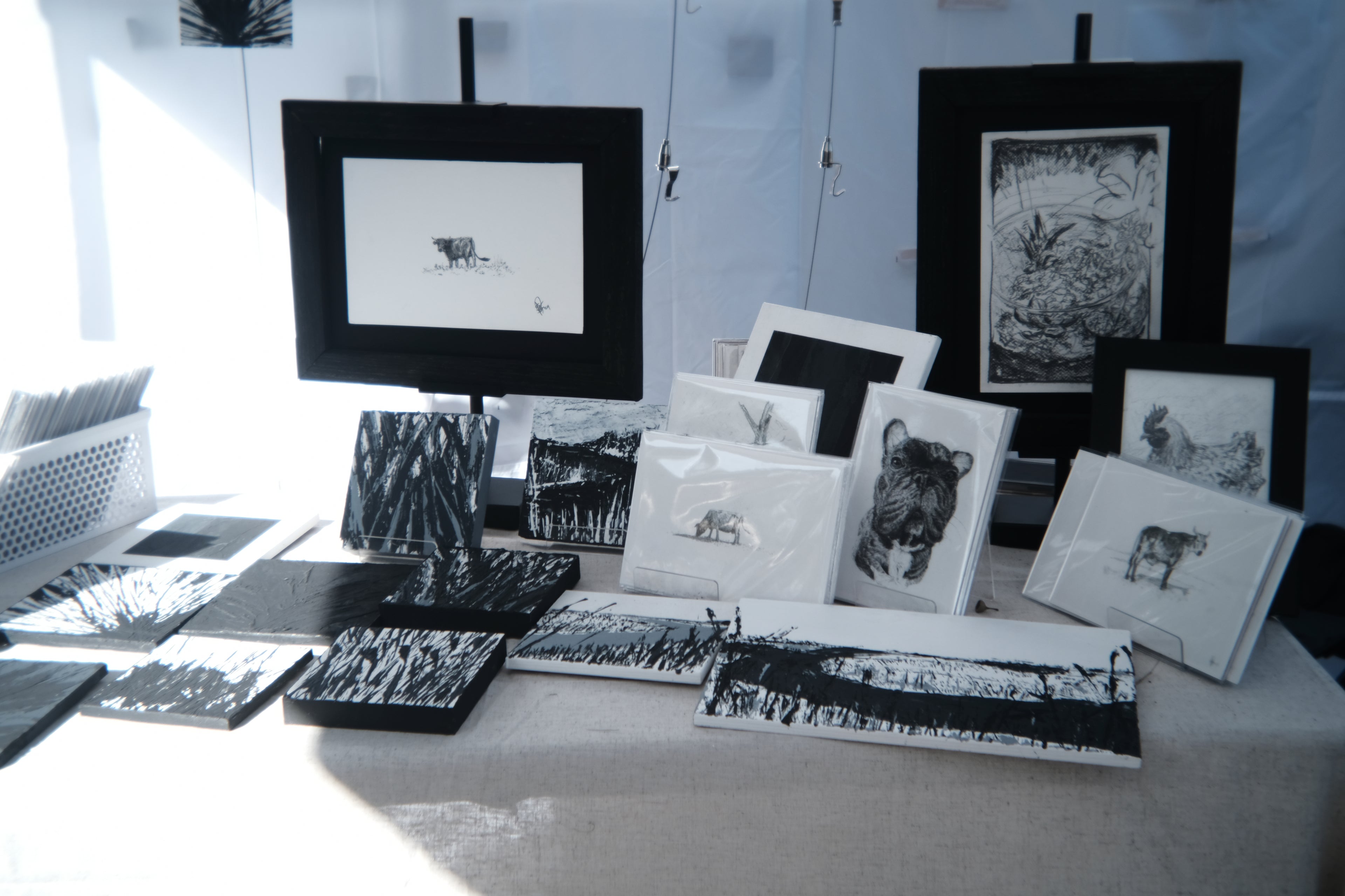 Finished graphite animal series pieces displayed at the Isle of Hope Art and Music Festival
